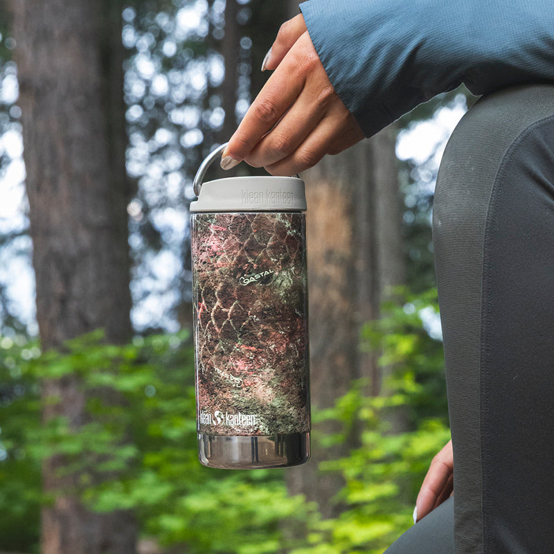 12oz-tkwide-with-twist-cap-mossy-oak-j2 12oz_tumbler_mossyoak_rainbowtrout_hand_closeup_square.jpg
