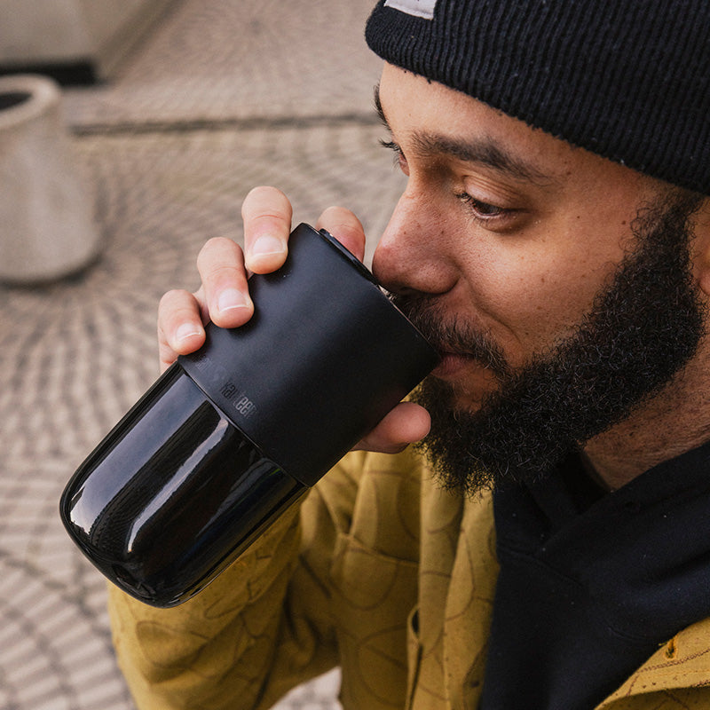 16oz-rise-tumbler-o2 16oz_rise_tumbler_black_man_drink_square.jpg