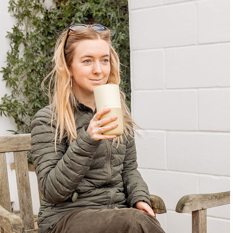 16oz-rise-tumbler-o2 16oz_rise_tumbler_wax_yellow_woman_seat_outside_square.jpg