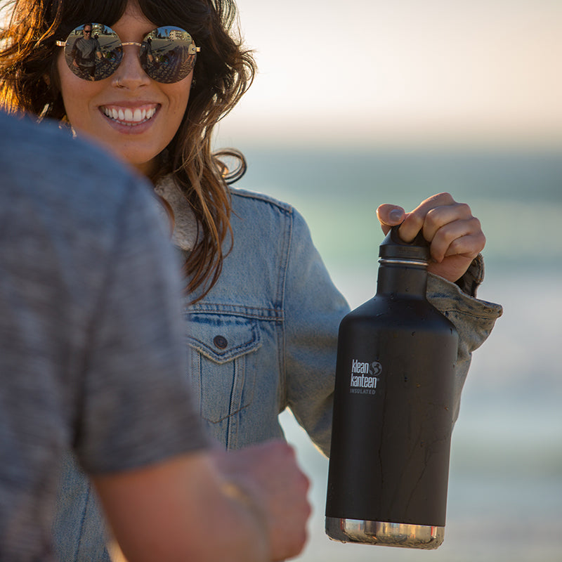 64oz-classic-with-loop-cap-o9 64oz_insulated_classic_black_beach_girl_hand_square.jpg