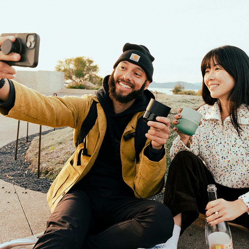 bring-your-own-party-kit-tumblers-and-cocktails-r5 8oz_rise_lowball_black_iceberg_couple_selfie_city_square.jpg