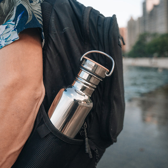 27oz-reflect-with-bamboo-cap-o9 K27SSLRF-MS-BAMBOO_reflect-bottle_backpack_lifestyle.jpg