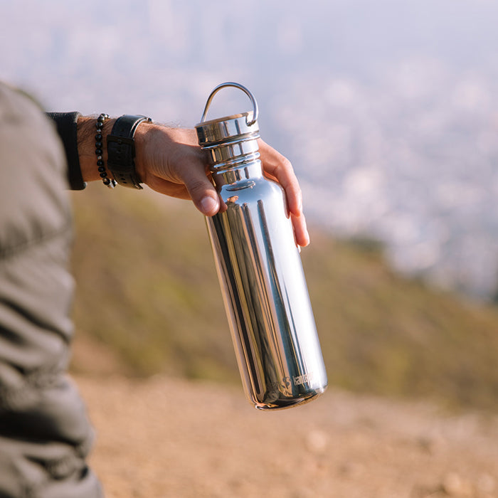 27oz-reflect-with-bamboo-cap-o9 K27SSLRF-MS-BAMBOO_reflect_bottle_hand_lifestyle.jpg