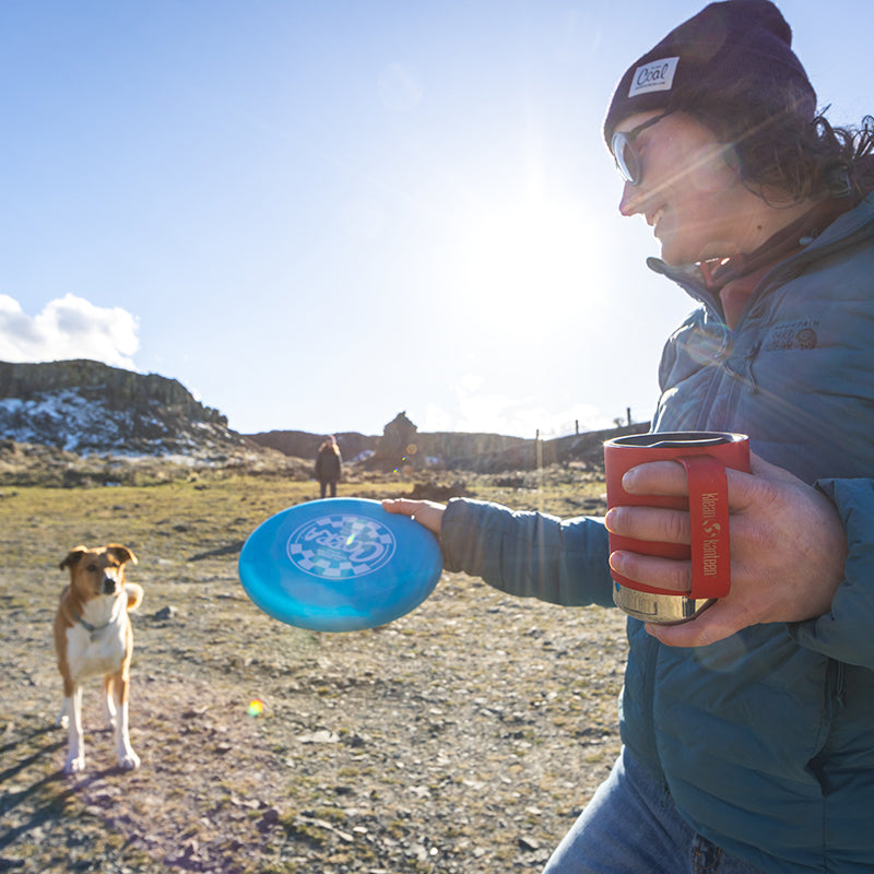 12oz-camp-mug-q0 insulated_camp_mug_12oz_woman_dog_frisbee_square.jpg